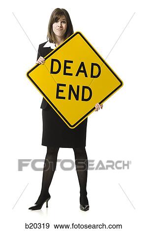 "person holding a ""dead end"" sign" View Large Photo Image Stock Photo - "person holding a ""dead end"" sign". Fotosearch