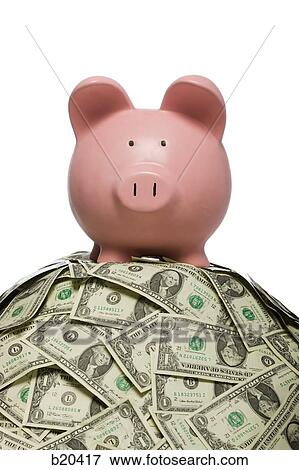 piggy bank on a pile of money View Large Photo Image Stock Photo - piggy bank on a pile of money. Fotosearch