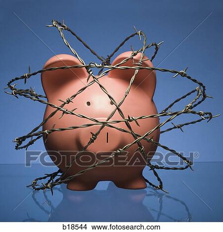 Piggy bank surrounded by barbed wire. View Large Photo Image Picture - Piggy bank surrounded by barbed wire.. Fotosearch