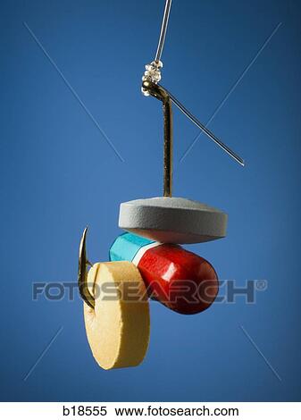 Stock Photography - Pills on a fish hook.. Fotosearch
