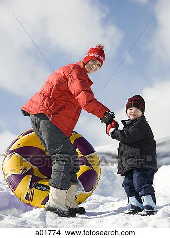 Picture - playing in the snow. Fotosearch