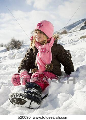 Stock Image - playing in the snow. Fotosearch