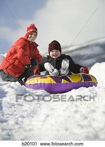 Stock Image - playing in the snow. Fotosearch