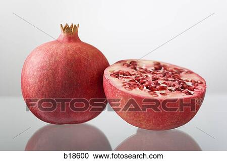 Pomegranate and a half. View Large Photo Image Stock Image - Pomegranate and a half.. Fotosearch