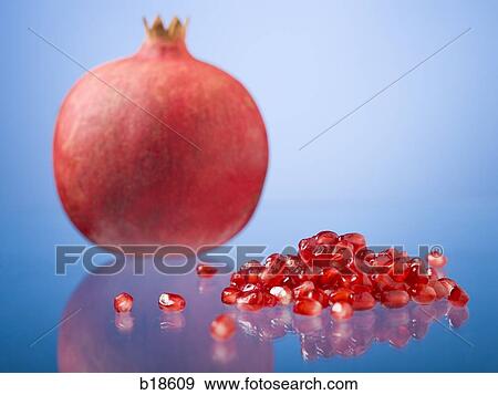 Pomegranate and pomegranate seeds. View Large Photo Image Stock Photo - Pomegranate and pomegranate seeds.. Fotosearch