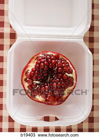 Stock Image - pomegranate in a fast food container. Fotosearch