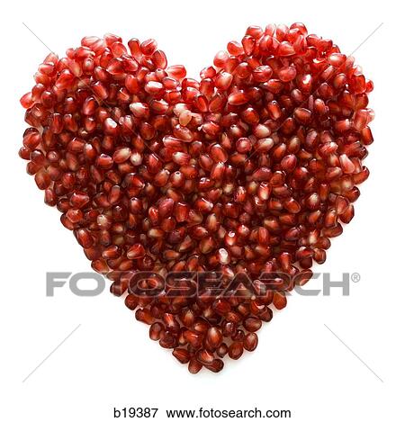 pomegranate seeds shaped into a heart View Large Photo Image Stock Photo - pomegranate seeds shaped into a heart. Fotosearch
