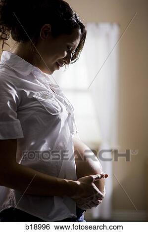 Stock Photograph - Pregnant woman.. Fotosearch
