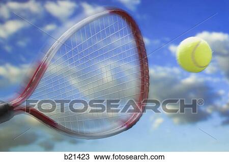 Stock Image - racket hitting a tennis ball. Fotosearch