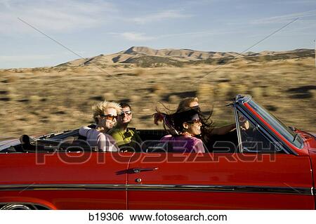 Stock Photograph - red car driving down the road. Fotosearch