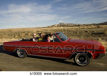 red car driving down the road View Large Photo Image Stock Photography - red car driving down the road. Fotosearch