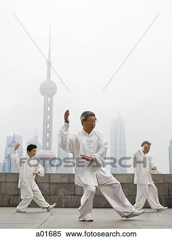 Stock Photography - senior practicing tai chi.. Fotosearch