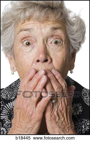 Stock Photography - Senior woman looking surprised.. Fotosearch