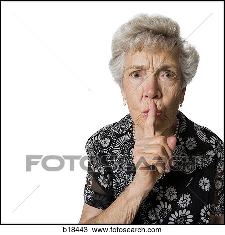 Senior woman shushing camera. View Large Photo Image Stock Image - Senior woman shushing camera.. Fotosearch