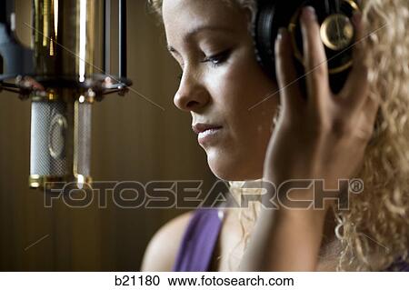 singing in a recording studio View Large Photo Image Stock Image - singing in a recording studio. Fotosearch
