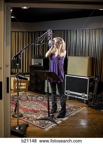 singing in a recording studio View Large Photo Image Stock Photo - singing in a recording studio. Fotosearch