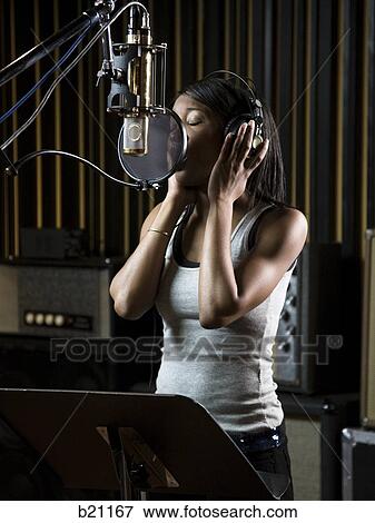 Stock Photo - singing in a recording studio. Fotosearch