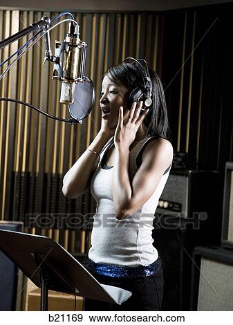 singing in a recording studio View Large Photo Image Stock Photo - singing in a recording studio. Fotosearch