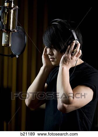singing in a recording studio View Large Photo Image Stock Photo - singing in a recording studio. Fotosearch
