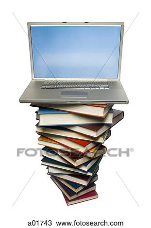 Stock Image - stack of books with a laptop computer on top. Fotosearch