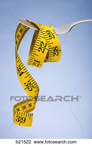 tape measure on a fork View Large Photo Image Stock Image - tape measure on a fork. Fotosearch