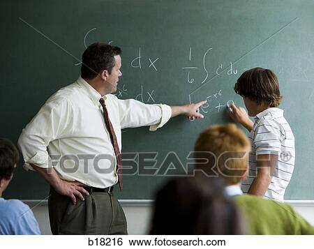 Stock Photograph - Teacher and students in a classroom.. Fotosearch