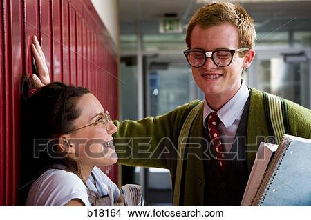 "Teenage couple at school, or, ""Nerd Love""" View Large Photo Image Picture - "Teenage couple at school, or, ""Nerd Love""". Fotosearch