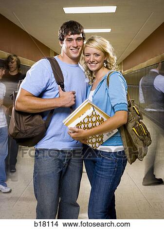 Teenage couple at school. View Large Photo Image Picture - Teenage couple at school.. Fotosearch