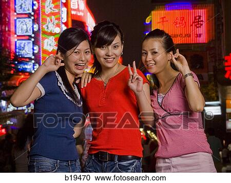 three woman on the street View Large Photo Image Stock Image - three woman on the street. Fotosearch
