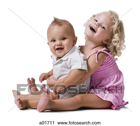 Stock Image - Toddler girl and baby boy.. Fotosearch