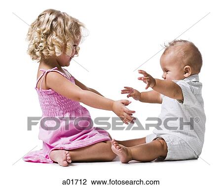 Stock Image - Toddler girl and baby boy.. Fotosearch