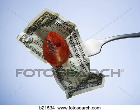 Picture - tomato and dollar on a fork. Fotosearch