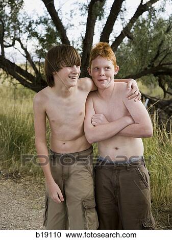 two boys playing in the woods. View Large Photo Image Stock Image - two boys playing in the woods.. Fotosearch