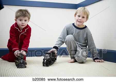two boys playing wth toys View Large Photo Image Stock Photography - two boys playing wth toys. Fotosearch