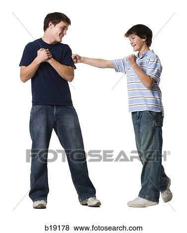 Stock Photo - two brothers wrestling.. Fotosearch