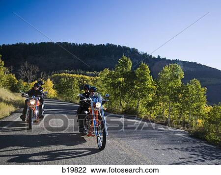 Stock Image - two couples on motorcycles. Fotosearch