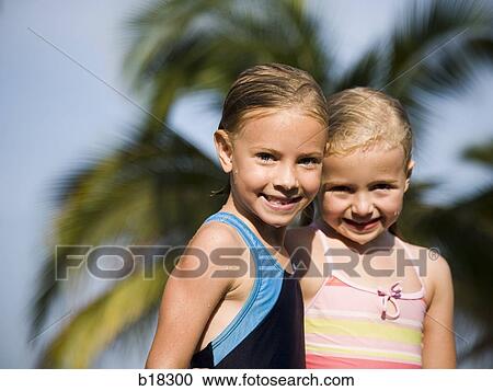 Two girls at the beach. View Large Photo Image Stock Image - Two girls at the beach.. Fotosearch