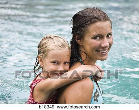 Two girls in a swimming pool. View Large Photo Image Stock Photo - Two girls in a swimming pool.. Fotosearch