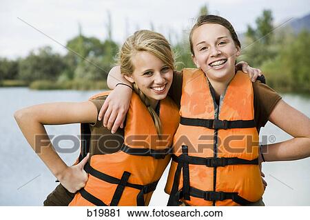 two girls in life vests View Large Photo Image Stock Image - two girls in life vests. Fotosearch