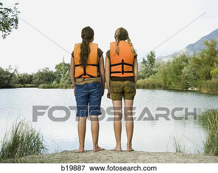 Stock Photo - two girls in life vests. Fotosearch