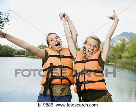 two girls in life vests View Large Photo Image Stock Photograph - two girls in life vests. Fotosearch