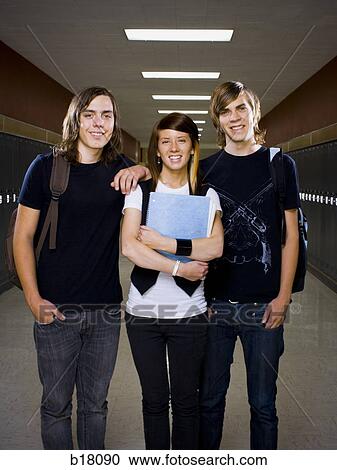 Stock Image - Two male and one female High School Students.. Fotosearch