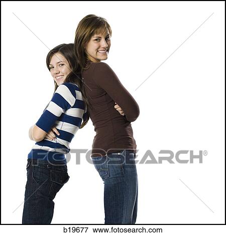 two woman looking at camera View Large Photo Image Stock Photo - two woman looking at camera. Fotosearch