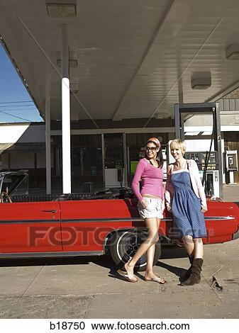 two women at a gas station. View Large Photo Image Stock Image - two women at a gas station.. Fotosearch