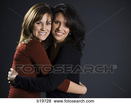 two women hugging View Large Photo Image Stock Photo - two women hugging. Fotosearch