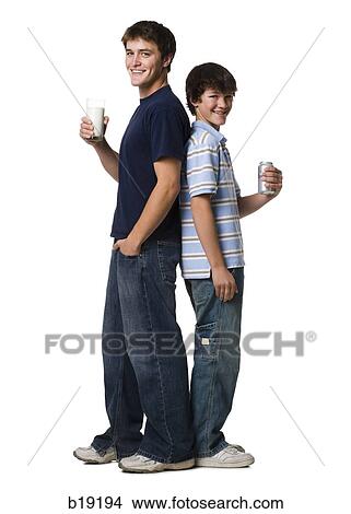 two young men drinking milk and soda. View Large Photo Image Picture - two young men drinking milk and soda.. Fotosearch
