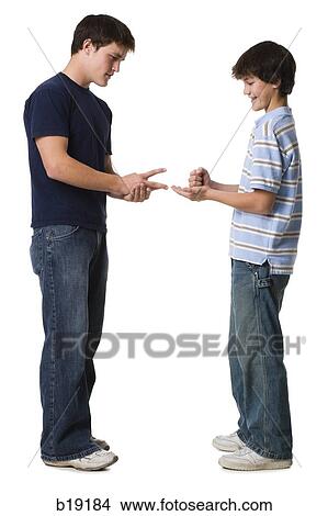 "Two young men playing rock, paper, scissors. " View Large Photo Image Picture - "Two young men playing rock, paper, scissors. ". Fotosearch