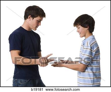 "Two young men playing rock, paper, scissors. " View Large Photo Image Stock Image - "Two young men playing rock, paper, scissors. ". Fotosearch