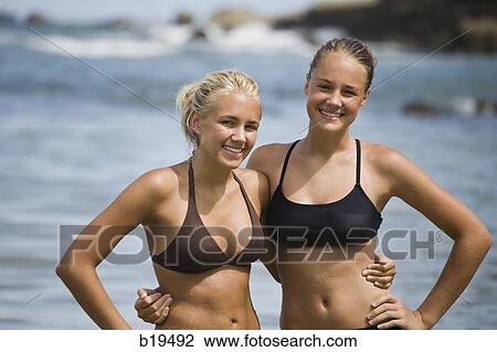 two young women at the beach View Large Photo Image Stock Image - two young women at the beach. Fotosearch