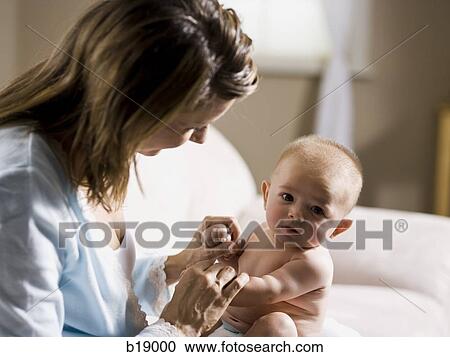 Stock Image - Woman and baby.. Fotosearch